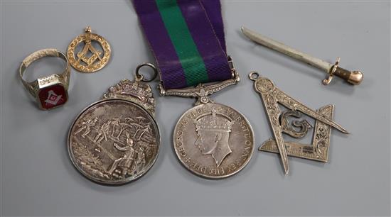 Three masonic items including gold Malaya medal, another medal and sword brooch